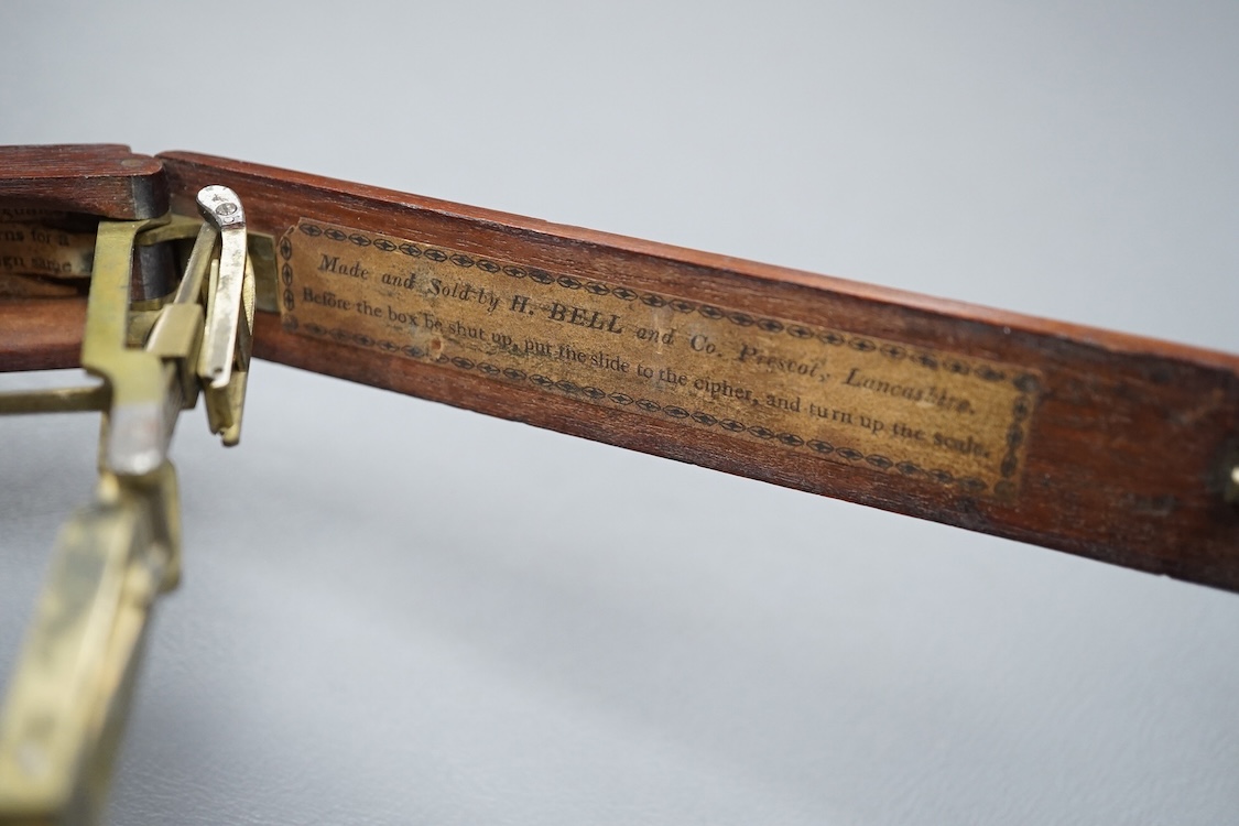 A set of 19th century brass and mahogany folding sovereign scales, 14cm long.